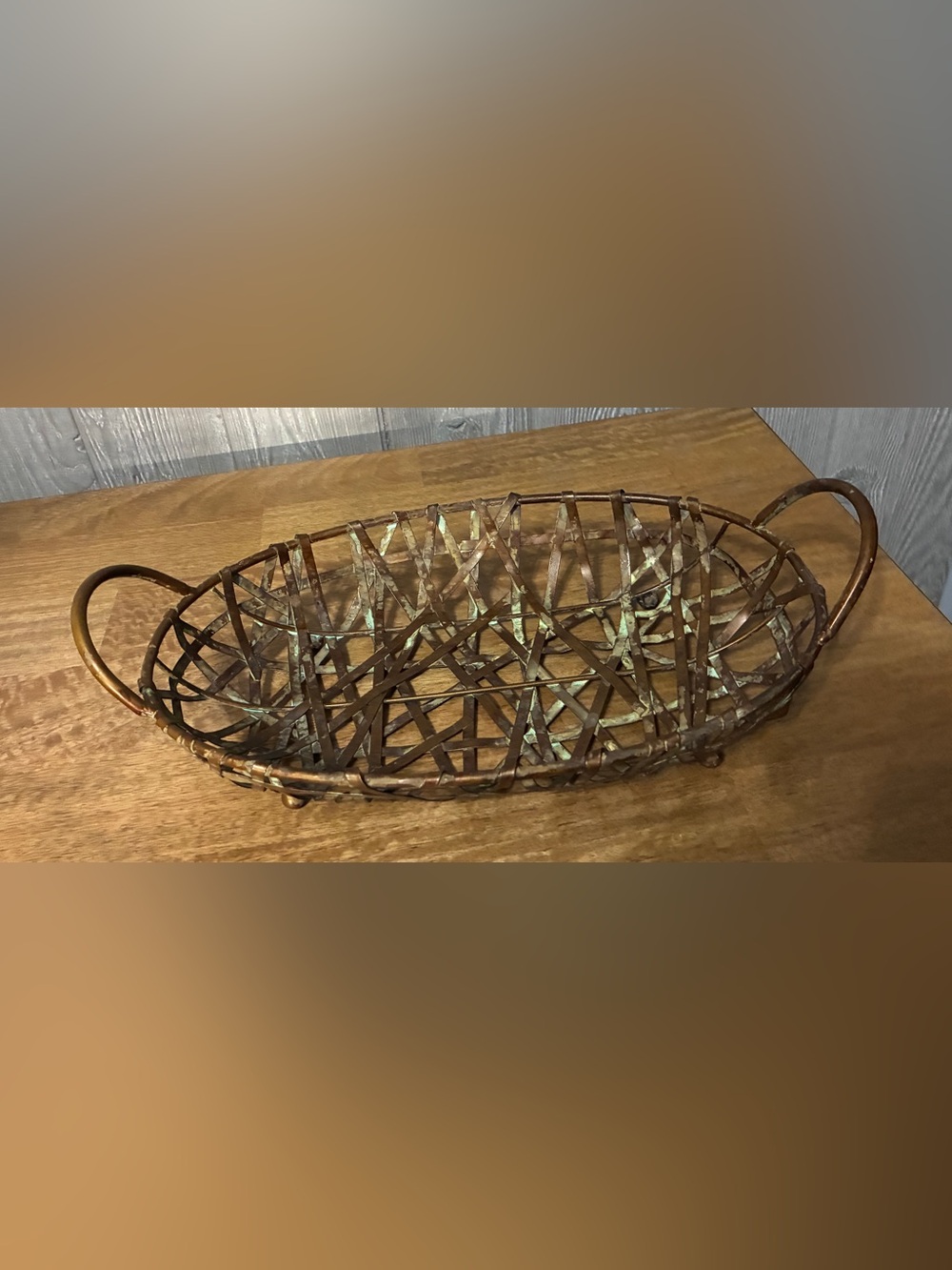 This centerpiece is a vintage woven Rustic Woven Metal Oval Basket
